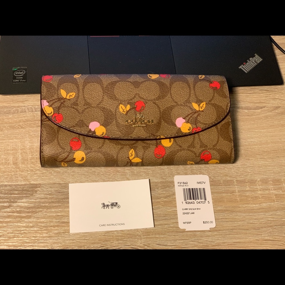 SLIM ENVELOPE WALLET IN SIGNATURE CANVAS